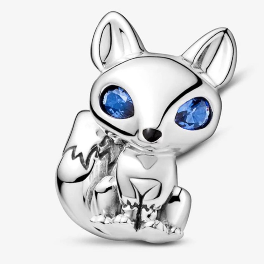Blue eyed fox charm